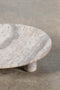 Round Footed Plate in Grey Travertine, close up